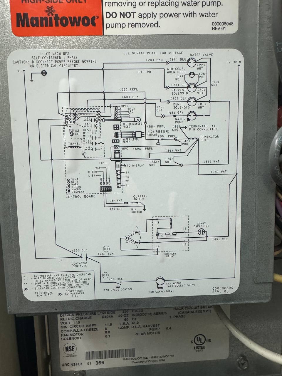 The Manitowoc control board and wiring diagram inside the ice machine's electrical panel.